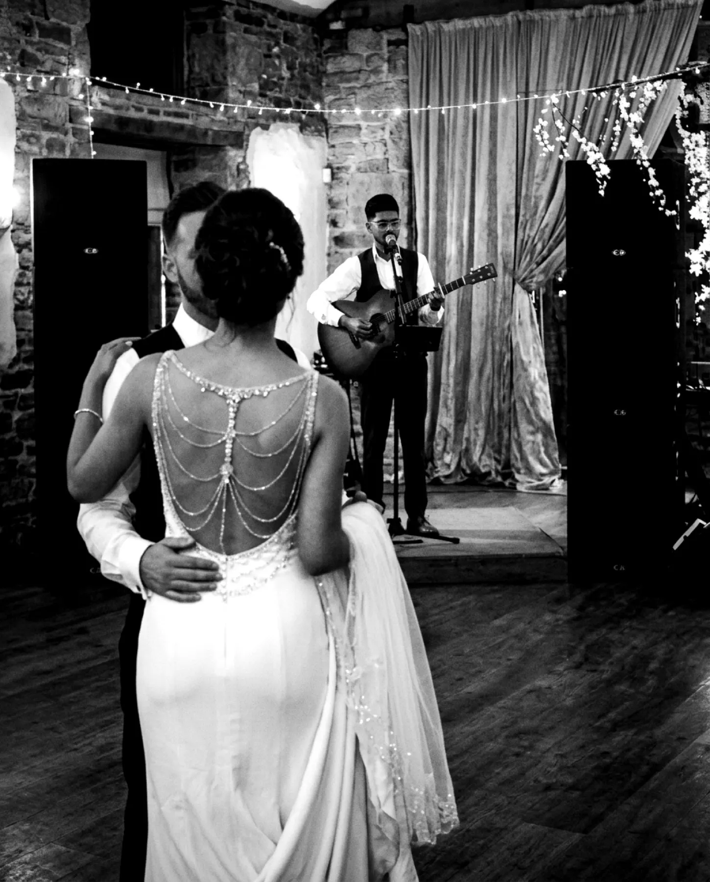 Couple dancing under sparklers at night