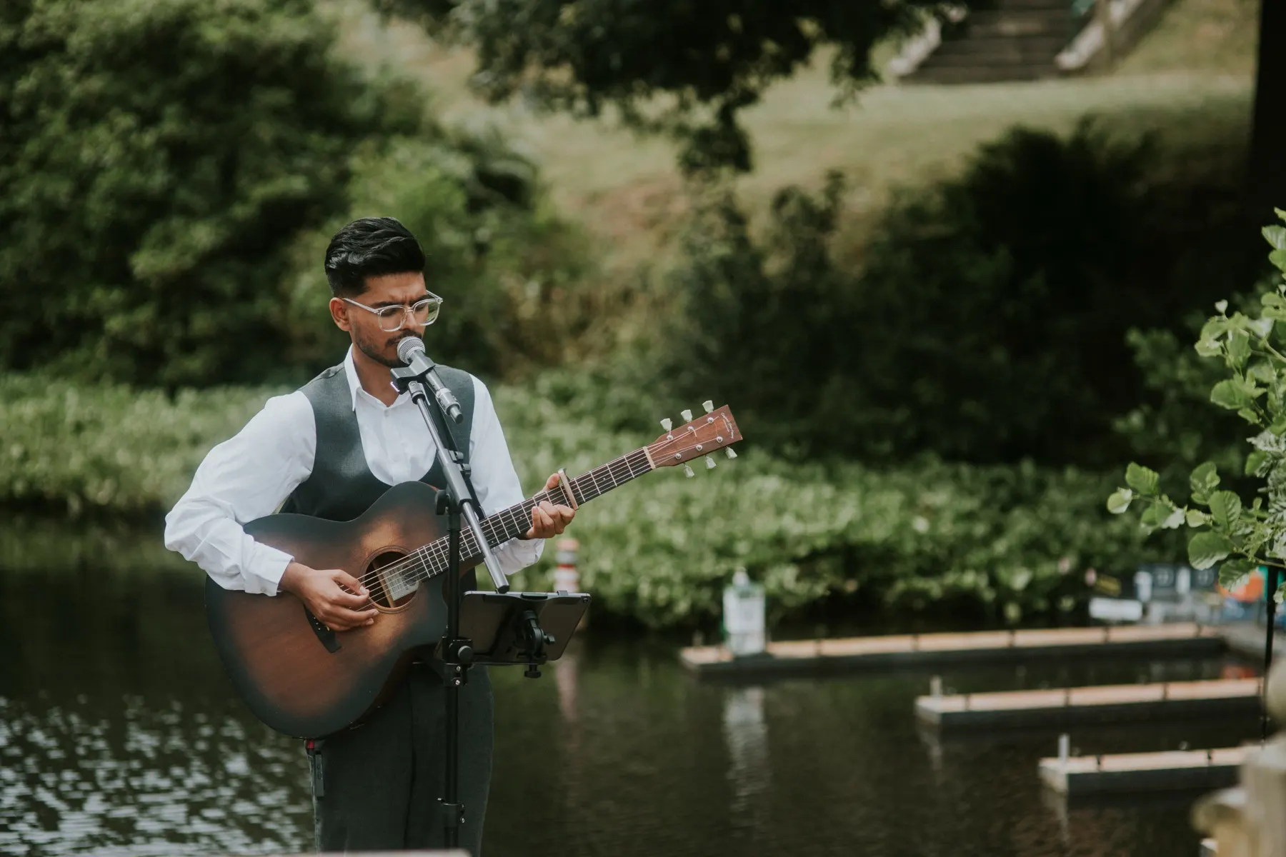 Puskar singing during an outdoor wedding